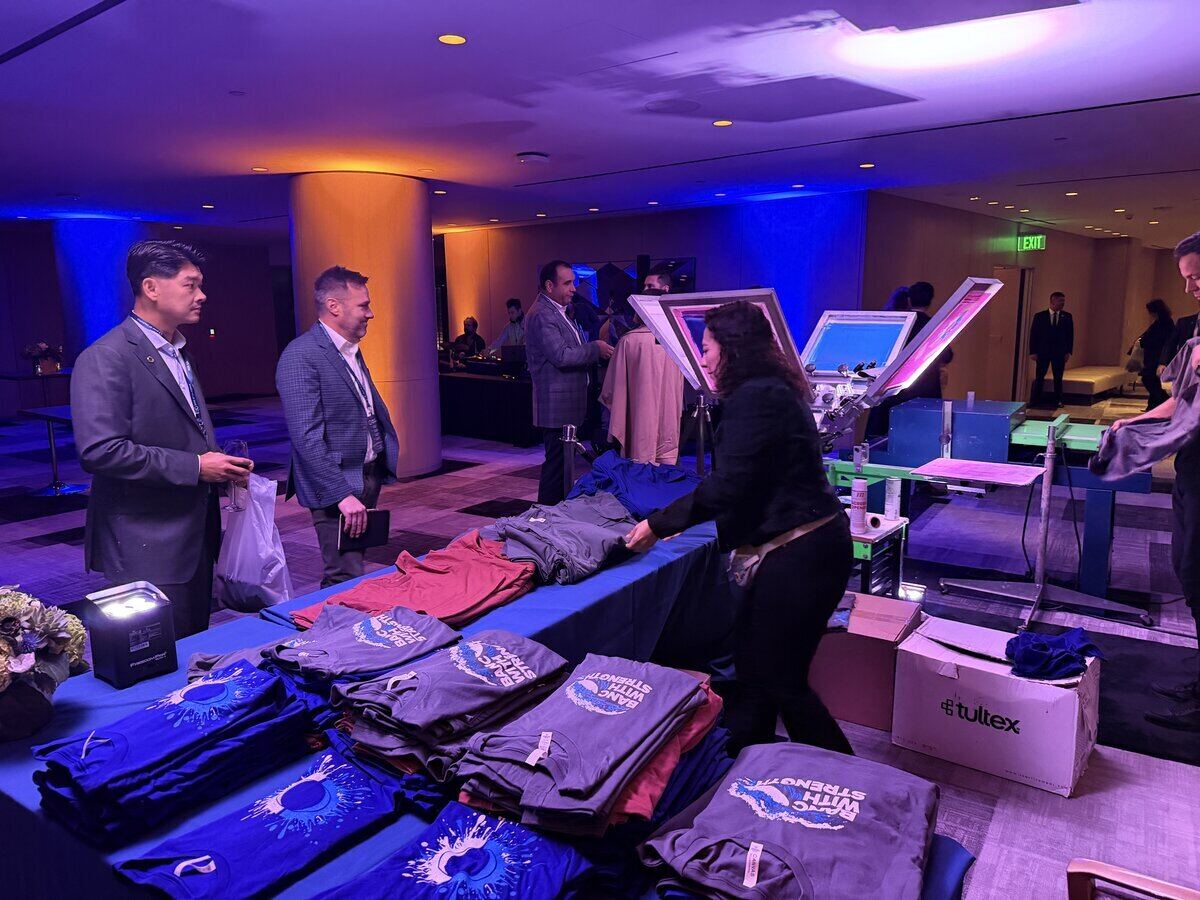 Merch Troop crew staging an on-site printing booth before an event opens
